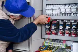 Electrician working on an electrical panel, upgrading it